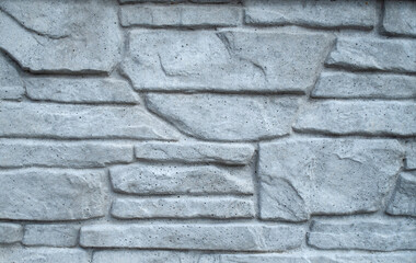 Gray concrete surface imitating stone closeup