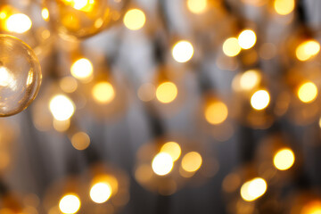 Obraz premium Close up of bunch of lights on wall with blurry background.