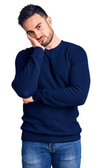 Young handsome man wearing casual clothes thinking looking tired and bored with depression problems with crossed arms.