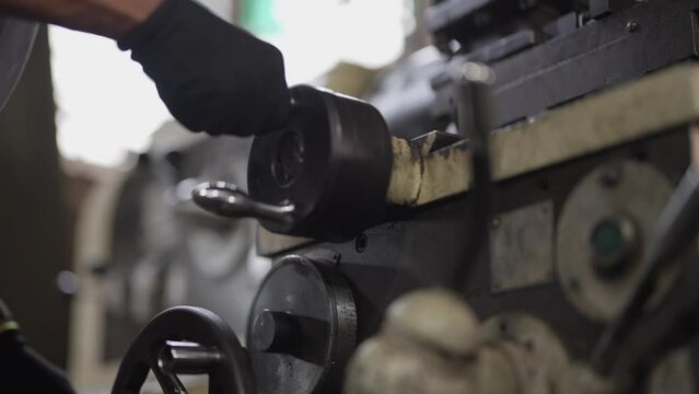 close up of machine operation for Metal Lathes. The steel column rolling in machine. metalworking industry. finishing metal working internal steel surface on lathe grinder machine with flying sparks
