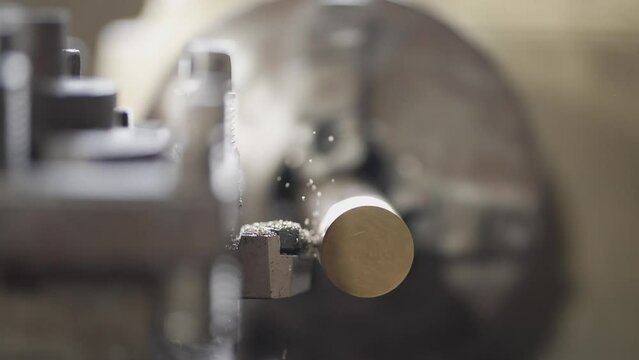 close up of machine operation for Metal Lathes. The steel column rolling in machine. metalworking industry. finishing metal working internal steel surface on lathe grinder machine with flying sparks