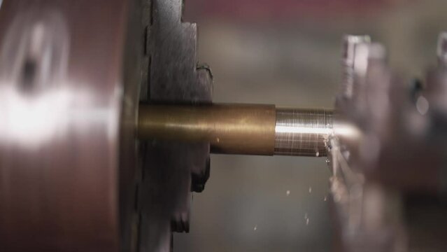 close up of machine operation for Metal Lathes. The steel column rolling in machine. metalworking industry. finishing metal working internal steel surface on lathe grinder machine with flying sparks