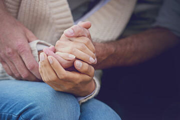 Couple, holding hands and closeup with love and support with empathy for illness, diagnosis and...