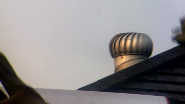 industrial single roof ventilator spinning in 4k still zoom footage background