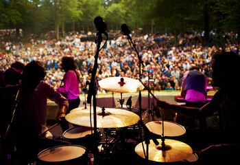 Band, concert and stage in outdoors, party and event or energy for freedom on vacation. People,...