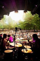 Band, concert and stage in outdoors, event and party or energy for freedom on vacation. People,...
