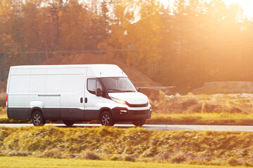 On the Delivery Route. Commercial Van Close-Up on the Road. Logistics branding. Commercial van on...
