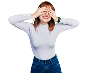 Redhead young woman wearing casual turtleneck sweater covering eyes with hands smiling cheerful and funny. blind concept.