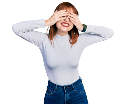 Redhead young woman wearing casual turtleneck sweater covering eyes with hands smiling cheerful and funny. blind concept.
