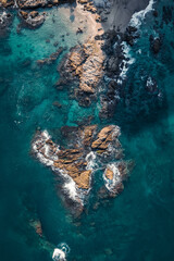 aerial view of rocks in the ocean