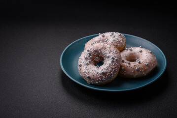 Delicious fresh donut of white or beige color with silver beads and cream