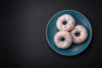 Delicious fresh donut of white or beige color with silver beads and cream