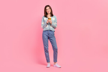 Full length photo of adorable cute woman dressed teal outfit chatting telegram facebook instagram...