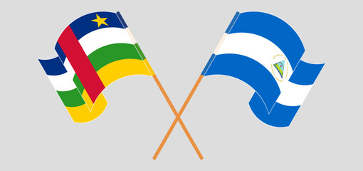 Crossed and waving flags of Central African Republic and Nicaragua