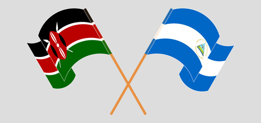 Crossed and waving flags of Kenya and Nicaragua