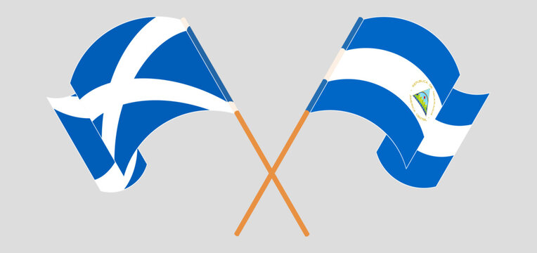 Crossed and waving flags of Scotland and Nicaragua
