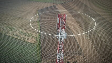 5G mobile tower station with graphics of microwave pollution and binary code. Aerial view over a plowed land 