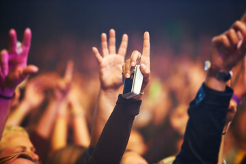 Hands, camera and a crowd of people at a music festival closeup with energy for freedom or...