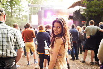 Woman, portrait and outdoor music festival with crowd for party, event or DJ in nature. Face of happy female person smile and enjoying sound or audio at carnival, concert or performance outside - obrazy, fototapety, plakaty
