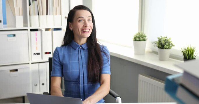 Manager brings many folders to young woman secretary to work with documents. Successful teamwork concept