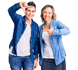 Couple of women wearing casual clothes smiling making frame with hands and fingers with happy face. creativity and photography concept.