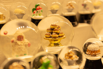 Magical snow globe with decorations and cookies inside