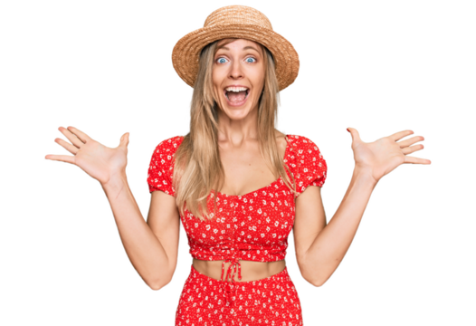 Beautiful caucasian woman wearing summer hat celebrating crazy and amazed for success with arms raised and open eyes screaming excited. winner concept - Powered by Adobe