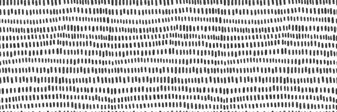 Hand drawn small dash seamless pattern. Black grunge doodle stroke on white background. Abstract vector wallpaper, print. 