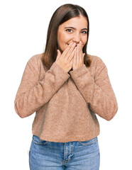 Young beautiful woman wearing casual clothes laughing and embarrassed giggle covering mouth with hands, gossip and scandal concept