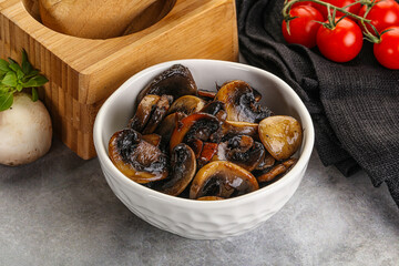 Roasted champignon mushrooms in the bowl