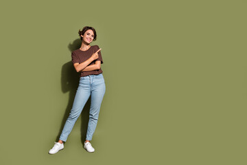Full size photo of satisfied woman dressed t-shirt indicating at profitable proposition empty space...