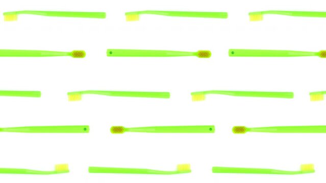 Colorful toothbrushes. Colorful toothbrushes on a white background. Stop motion concept. 