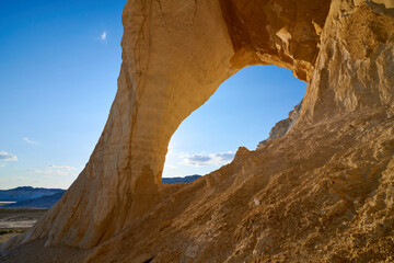  Natural arch on the Tuzbair salt marsh. Natural arch at Tuzbair is a natural formation carved by erosion.Salt marsh Tuzbair is one of the most famous attractions of the Mangystau region of Kazakhstan