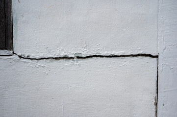 Cracked concrete building broken wall or pole outside house