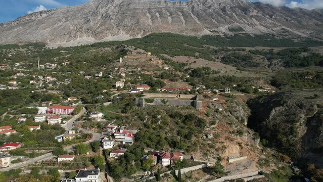 Aerial panoramic view of Libohove Castle, a historic stronghold built by Ali Pasha of Ioannina, located in southern Albania near the town of Gjirokaster.

