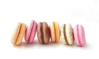 Colored stacked french macaroons on white background. Tasty colorful macaron assorted. Macaroons cakes of different colors. Culinary and cooking concept.