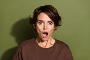 Photo portrait of lovely young lady open mouth frightened reaction dressed stylish brown garment isolated on khaki color background