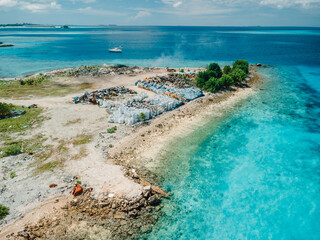 Dump island in paradise Maldives. Aerial view of pollution by toxic rubbish