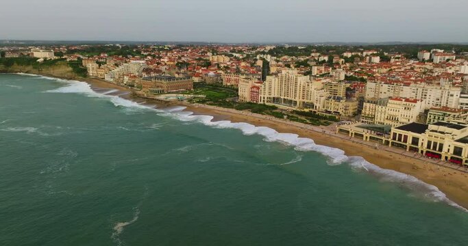 Biarritz large aerial view of the main beach and Biarritz city sunny afternoon France. View of facade of Hotel Sofitel Biarritz Le Miramar Thalassa Sea and Spa on the Miramar beach