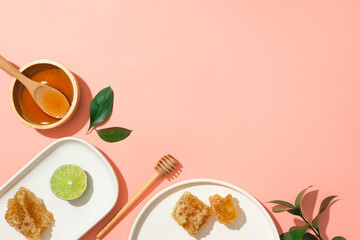 Ceramic dishes of lime and beeswax. A bowl filled with honey displayed with a honey dripping. Vacant space can be used to show your product