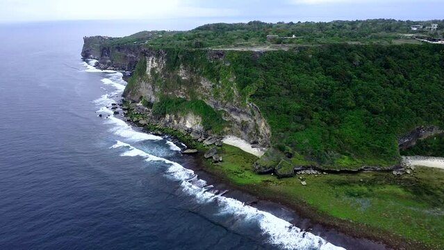 Aerial View By Drone 4K Camera. Ocean With Waves And Rocky Cliff.
