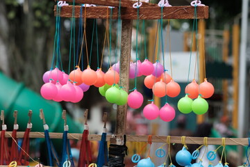 lato-lato or latto-latto. In USA named as clackers, click-clacks, knockers, ker-bangers, or clankers.  © Ika