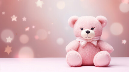 Toy bear on pink background with bokeh and stars.