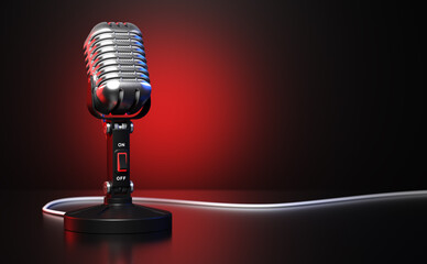 Vintage microphone in front of red and black background
