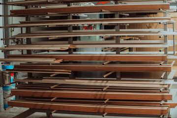 A vast warehouse in the forestry industry, showcasing a plethora of wooden products, including boards and various timber items neatly organized in storage