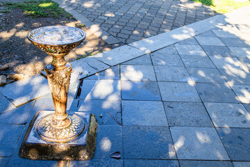travel to Georgia - fountain with drinking water on street of Batumi city in autumn morning