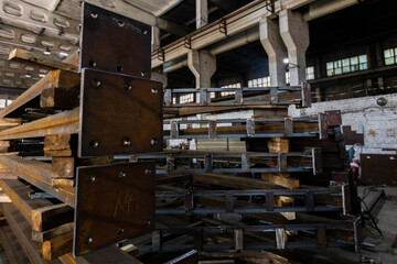 Various metal structures cut in the workshop. The factory produces metal parts, elements, and structures. Plant for the production of metal structures.