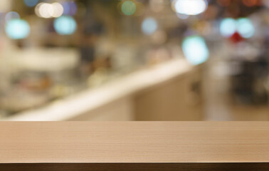 Empty wood table top and blur of out door garden background Empty wooden table space for text marketing promotion. blank wood table copy space for background