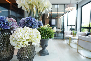 Home interior decor dried flowers in glass vase in Living room decoration. rustic brown wooden table restaurant cafe interior