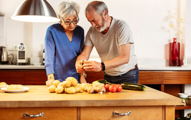 senior couple cooking healthy food together